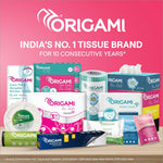 Origami 2-Ply Facial Tissue Box displayed in a car cup holder, illustrating the portability of soft facial tissues for on-the-go use.