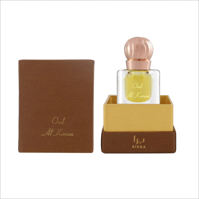 Oud Al Karam 6ML scent in a glass bottle, presented in a luxurious packaging with brown and gold accents, showcasing its elegant design.