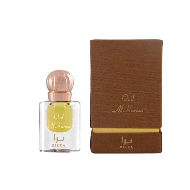 Oud Al Karam 6ML fragrance bottle by BIRRA displayed alongside its elegant packaging, featuring a golden cap and a luxurious brown and gold design.