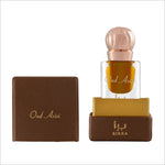 Close-up of Oud Azizi attar bottle showcasing its elegant design with a rose gold cap, resting on a brown box inscribed with the brand BIRRA.
