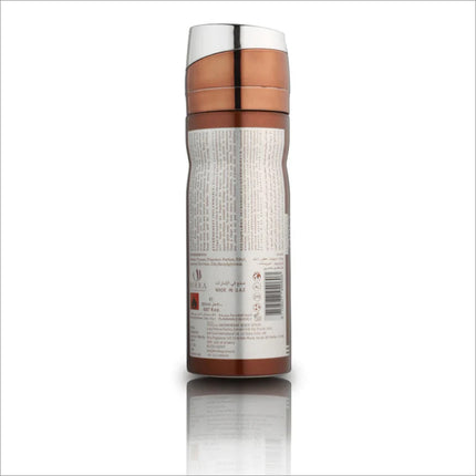 Back view of Oud Obsession deodorant bottle by BIRRA, showcasing detailed labeling and information. The sleek design features a metallic cap and a brown cylindrical body, reflecting a premium aesthetic.