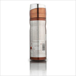 Back view of Oud Obsession deodorant bottle by BIRRA, showcasing detailed labeling and information. The sleek design features a metallic cap and a brown cylindrical body, reflecting a premium aesthetic.