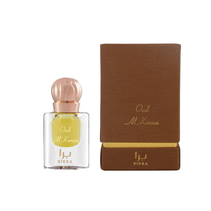 Oud Al Karam 6ML fragrance bottle by BIRRA displayed alongside its elegant packaging, featuring a golden cap and a luxurious brown and gold design.