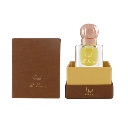 Oud Al Karam 6ML scent in a glass bottle, presented in a luxurious packaging with brown and gold accents, showcasing its elegant design.