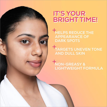 A woman with dark hair wearing a white top against an orange gradient background with renee everyday face bright serum