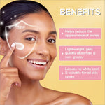 a woman smiling and touching her face with her hand