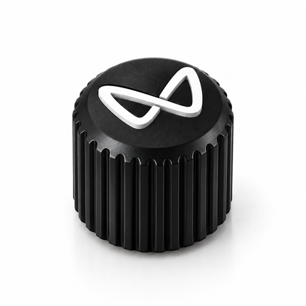 Close-up of black ribbed valve cap and white logo