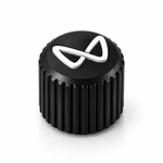 Close-up of black ribbed valve cap and white logo