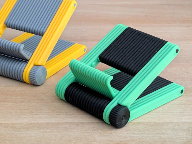 Mint green and black foldable 3D printed phone stand open