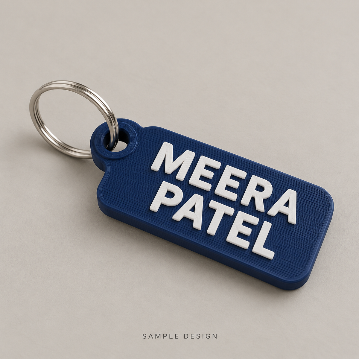 Personalized Name Keychain – Two Lines, 10 Letters — illustrative sample mockup, metal keyring shown