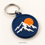 Rubnic sample navy 3D printed mountain badge keychain with white mountains and orange sun