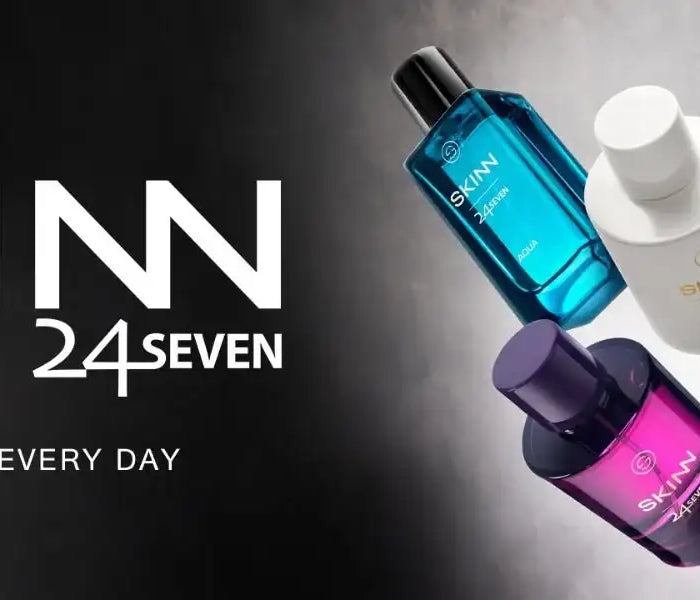 The skinn 24/7 collection features sleek, modern perfume bottles in vibrant translucent colors like blue, white, amber, and purple with minimalist black caps.