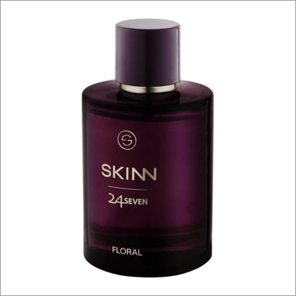 a bottle of skinn cologne on a white background