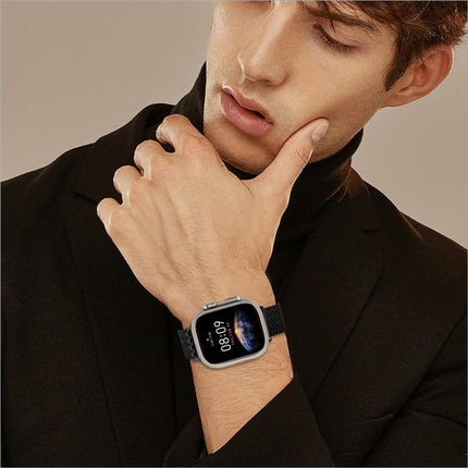 Silver-framed apple watch with black textured stainless steel magnetic clasp strap displaying time 08 08 on earth background