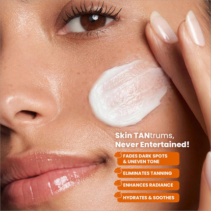 A dollop of white creamy swiss beauty care d-tan pro-glow facial kit applied on cheek to boost brightness and reduce tanning