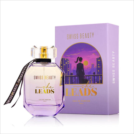 Close-up of the Swiss Beauty She Leads EDP bottle, emphasizing its long lasting perfume fragrance with notes of Elemi and Violet Flower.
