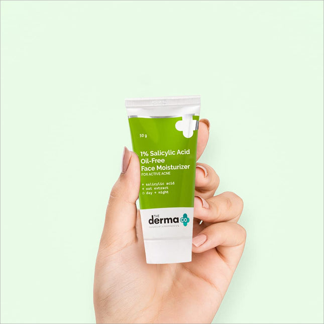 a hand holding a tube of derma the sulsyly acid face moister