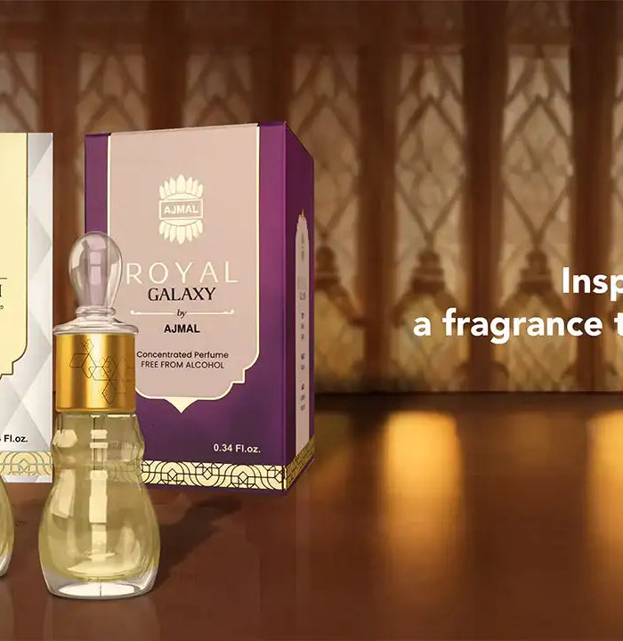 Three elegant glass perfume bottles with gold caps, each paired with a distinctively colored box—brown for royal oud kuwaiti, cream for royal misk alau, and purple for royal galaxy.