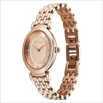 a women's watch with a gold bracelet