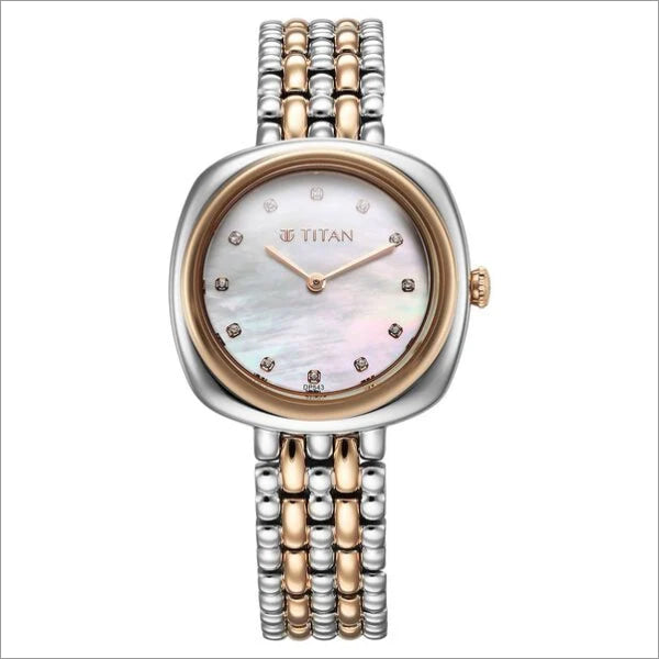 a women's watch with two tone gold and silver bracelets