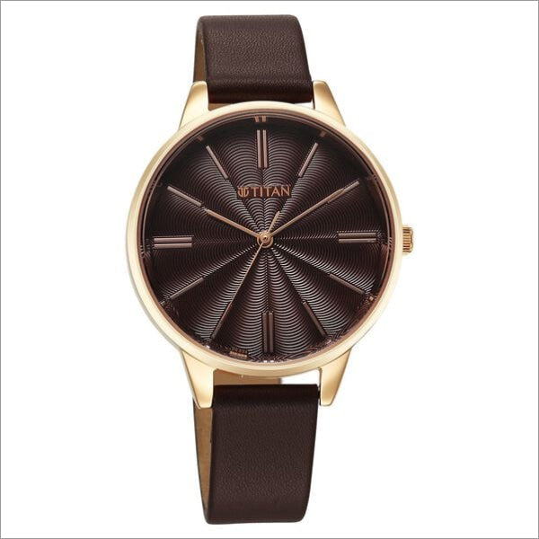 a watch with a brown leather strap