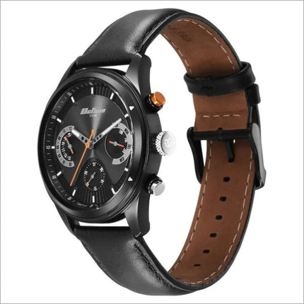 a black watch with a brown leather strap