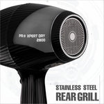 a black hair dryer sitting on top of a table