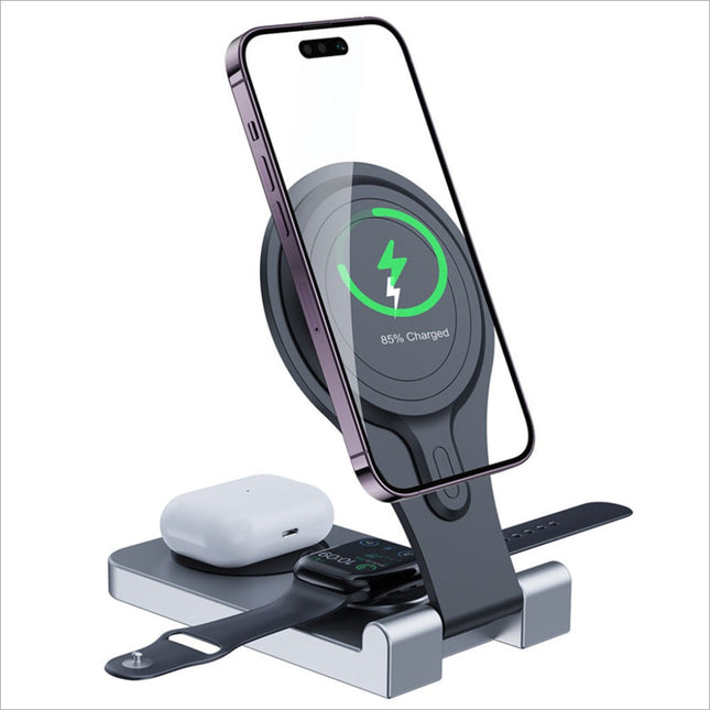 A sleek silver magnetic wireless charger portable folding stand with black accents charging an iPhone at 85 percent