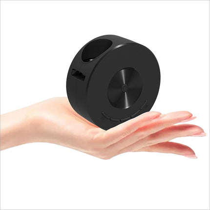 Black cylindrical portable speaker with brushed metal accents next to yt200 usb rechargeable mini projector for korean skin care use