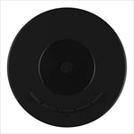 Black circular wireless charging pad with textured center and button indentations for yt200 mini projector use with korean skin care apps