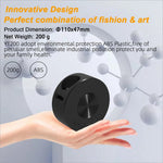 Black circular abs plastic device with textured disc and side openings for yt200 usb rechargeable mini projector skin care use