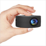 Black yt200 usb rechargeable mini projector emitting blue and green light ideal for korean skin care video tutorials