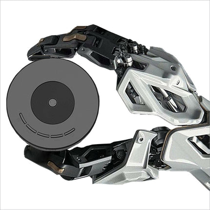 A sleek silver and black robotic arm holding a gray disc near the yt200 usb rechargeable mini projector for korean skin care tutorials