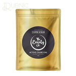The Beauty Co. Activated Charcoal Coffee Face and Body Scrub in gold packaging with black label