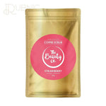 Strawberry Coffee Scrub by The Beauty Co in gold packaging with pink label for skin cleansing and lightening, 100g.